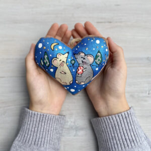 Coffee-Scented Heart with Mice Against Sky Background
